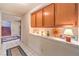 Bright hallway with oak cabinets and lovely decorative items at 4471 Borrego Springs Way, Las Vegas, NV 89129