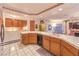 Another view of the kitchen featuring tile flooring, wood cabinets, and neutral color palette at 4471 Borrego Springs Way, Las Vegas, NV 89129