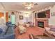 Inviting living room with brick fireplace and comfortable furnishings at 4471 Borrego Springs Way, Las Vegas, NV 89129