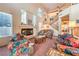 Cozy living room with fireplace, staircase and comfortable seating at 4471 Borrego Springs Way, Las Vegas, NV 89129