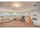 Second-floor loft with railing overlooking downstairs and a cozy seating area at 4471 Borrego Springs Way, Las Vegas, NV 89129