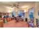 Charming home office with a ceiling fan, lots of windows, and comfortable seating at 4471 Borrego Springs Way, Las Vegas, NV 89129