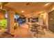An inviting covered patio with ceiling fan offers a relaxing space for outdoor dining and entertaining at 4471 Borrego Springs Way, Las Vegas, NV 89129