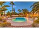 A refreshing pool and spa surrounded by lush tropical landscaping create a tranquil backyard escape at 4471 Borrego Springs Way, Las Vegas, NV 89129