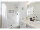 Clean bathroom featuring white vanity and a beautifully tiled shower, complete with modern fixtures at 4471 Wisconsin Ave, Las Vegas, NV 89104