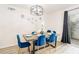 Bright dining area featuring modern lighting, new decor and slider to the back patio at 4471 Wisconsin Ave, Las Vegas, NV 89104