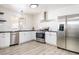 Modern kitchen with stainless steel appliances, sleek countertops, and ample cabinet space at 4471 Wisconsin Ave, Las Vegas, NV 89104