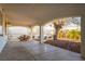 Covered patio with a picnic table and landscaped yard, perfect for outdoor relaxation and entertaining at 4471 Wisconsin Ave, Las Vegas, NV 89104
