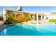 Inviting pool and covered patio, perfect for outdoor relaxation and entertaining at 4471 Wisconsin Ave, Las Vegas, NV 89104
