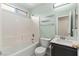 Bathroom featuring a tub, shower, dark vanity and ample lighting at 4846 Lone Grove Dr, Las Vegas, NV 89139