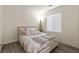 Cozy bedroom featuring a comfortable bed, neutral walls, and luxury vinyl plank flooring at 4846 Lone Grove Dr, Las Vegas, NV 89139