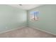 Well-lit bedroom featuring neutral walls, soft carpet, and a window for natural light at 4846 Lone Grove Dr, Las Vegas, NV 89139
