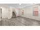 Light and airy living space with luxury vinyl plank flooring and staircase at 4846 Lone Grove Dr, Las Vegas, NV 89139