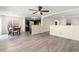 Open concept living space featuring luxury vinyl plank flooring and a view of the kitchen at 4846 Lone Grove Dr, Las Vegas, NV 89139