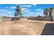 Spacious backyard with potential for landscaping and outdoor activities, surrounded by a block wall at 4848 Fuentes Cir, Las Vegas, NV 89121