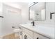 Bright bathroom featuring modern fixtures, a sleek vanity, and a framed mirror over the sink at 4848 Fuentes Cir, Las Vegas, NV 89121