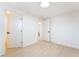 Bright bedroom features light-colored floors, white walls, closet and bathroom access at 4848 Fuentes Cir, Las Vegas, NV 89121