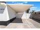 Covered carport offering ample parking space and protection from the elements with a privacy gate at 4848 Fuentes Cir, Las Vegas, NV 89121