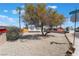 Quaint home with desert landscaping and mature tree in the front yard near the corner of Encina at 4848 Fuentes Cir, Las Vegas, NV 89121