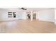 Open-concept living space featuring light-colored flooring, white walls, and a ceiling fan at 4848 Fuentes Cir, Las Vegas, NV 89121