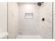 Walk-in shower showcasing marble-style tiling, a built-in niche, and modern black fixtures at 4848 Fuentes Cir, Las Vegas, NV 89121