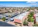 Aerial view of an apartment complex with a pool and tennis court at 4980 Indian River Dr # 447, Las Vegas, NV 89103