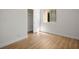 Cozy bedroom with wood flooring, window, and closet with sliding doors at 4980 Indian River Dr # 447, Las Vegas, NV 89103