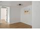 Bright bedroom with light wood flooring, white walls, and nautical decor at 4980 Indian River Dr # 447, Las Vegas, NV 89103