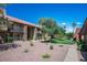 Condominium exterior featuring well-maintained landscape with walking paths at 4980 Indian River Dr # 447, Las Vegas, NV 89103