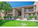 Condominium exterior featuring well-maintained lawn, stone accents and multiple balconies at 4980 Indian River Dr # 447, Las Vegas, NV 89103