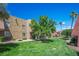 Inviting apartment complex with lush green lawns and mature trees, creating a serene outdoor environment at 4980 Indian River Dr # 447, Las Vegas, NV 89103