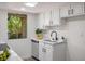 Modern kitchen featuring stainless steel sink, sleek cabinetry and ample counter space at 4980 Indian River Dr # 447, Las Vegas, NV 89103