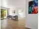 Bright living room featuring wood floors, a balcony and modern furnishings at 4980 Indian River Dr # 447, Las Vegas, NV 89103