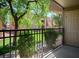 Outdoor patio with a black iron fence and lush green landscaping at 4980 Indian River Dr # 447, Las Vegas, NV 89103