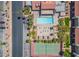 Overhead view of a refreshing pool, tennis court and recreational area amidst the attractive apartment complex at 4980 Indian River Dr # 447, Las Vegas, NV 89103