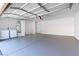 Spacious garage with an epoxy floor featuring a utility sink and washer-dryer hookups at 5250 S Rainbow Blvd # 1029, Las Vegas, NV 89118