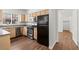 Kitchen with stainless steel appliances, wood cabinets, and granite countertops at 5250 S Rainbow Blvd # 1029, Las Vegas, NV 89118