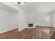 Open living room with a fireplace and access to the front door at 5250 S Rainbow Blvd # 1029, Las Vegas, NV 89118