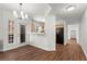 Spacious living room with wood flooring, dining area, and kitchen access at 5250 S Rainbow Blvd # 1029, Las Vegas, NV 89118