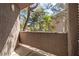 Outdoor patio offers a view of trees, flowers, and nearby apartment buildings at 5250 S Rainbow Blvd # 1029, Las Vegas, NV 89118