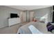 Spacious primary bedroom featuring a white dresser and access to an ensuite bathroom at 5269 Silver Branch Ave, Las Vegas, NV 89118