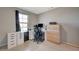 Carpeted bedroom featuring a workspace with drawers, a desk and a window allowing for natural light at 5269 Silver Branch Ave, Las Vegas, NV 89118