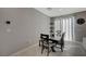 Well-lit dining area featuring tile flooring and access to the outside through glass doors at 5269 Silver Branch Ave, Las Vegas, NV 89118