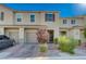 Beautiful townhome featuring a well-kept lawn and a brick driveway, offering both curb appeal and convenient parking at 5269 Silver Branch Ave, Las Vegas, NV 89118