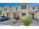 Charming townhome boasting a landscaped front yard, brick driveway, and convenient parking, adding to its desirability at 5269 Silver Branch Ave, Las Vegas, NV 89118