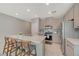 Well-lit kitchen featuring a center island, stainless steel appliances, and minimalist design, creating a clean and modern space at 5269 Silver Branch Ave, Las Vegas, NV 89118