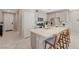 Stylish kitchen with island seating, stainless steel appliances, and sleek cabinets, combining functionality with contemporary design at 5269 Silver Branch Ave, Las Vegas, NV 89118