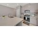 Bright kitchen with a large island, marble countertops, stainless steel appliances, and modern cabinets at 5269 Silver Branch Ave, Las Vegas, NV 89118