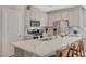 Bright kitchen featuring a large island, stainless steel appliances, and ample cabinet space, ideal for culinary enthusiasts at 5269 Silver Branch Ave, Las Vegas, NV 89118