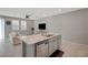 This kitchen features an island with marble countertops and stainless steel appliances at 5269 Silver Branch Ave, Las Vegas, NV 89118